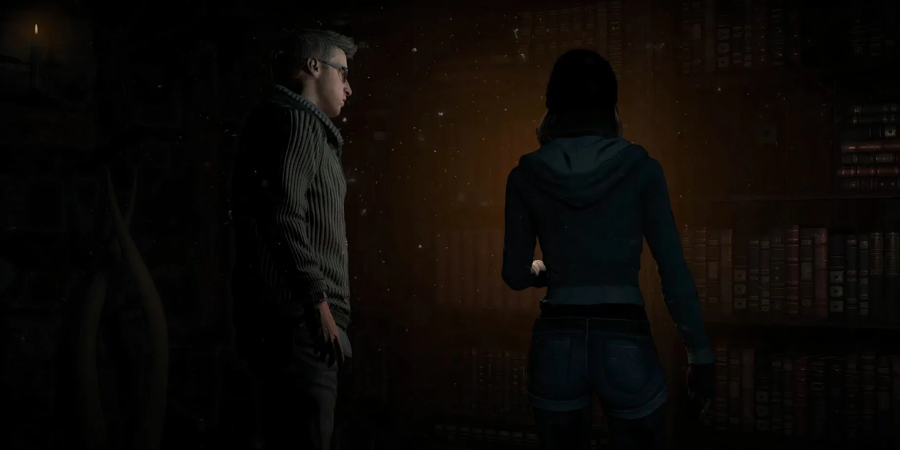 Các nhân vật trong Until Dawn đang tương tác gần một tủ sách trong một cảnh game kinh dị kịch tính