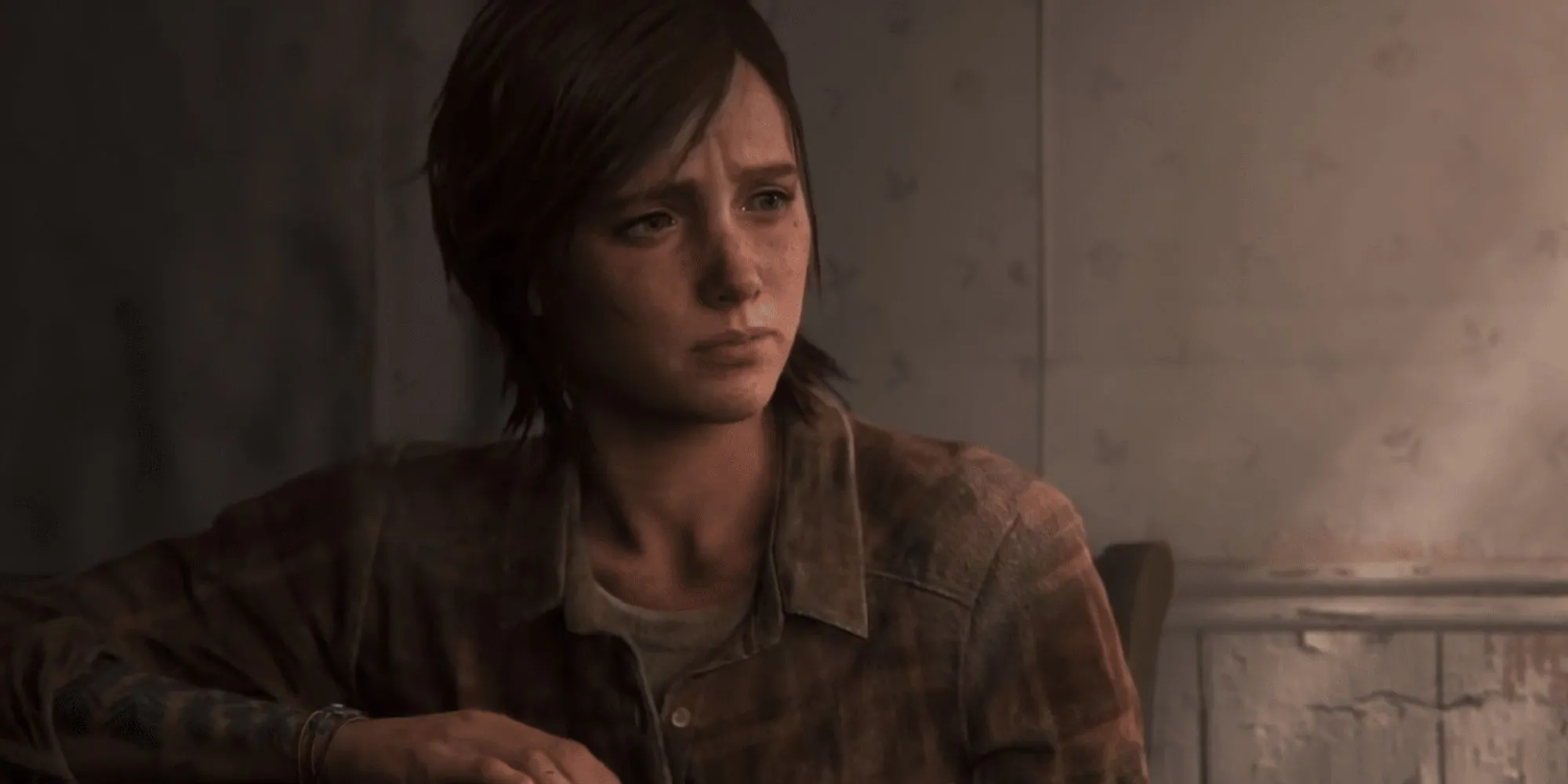 Ellie ngồi một mình trong căn nhà bỏ hoang ở cuối The Last of Us Part II