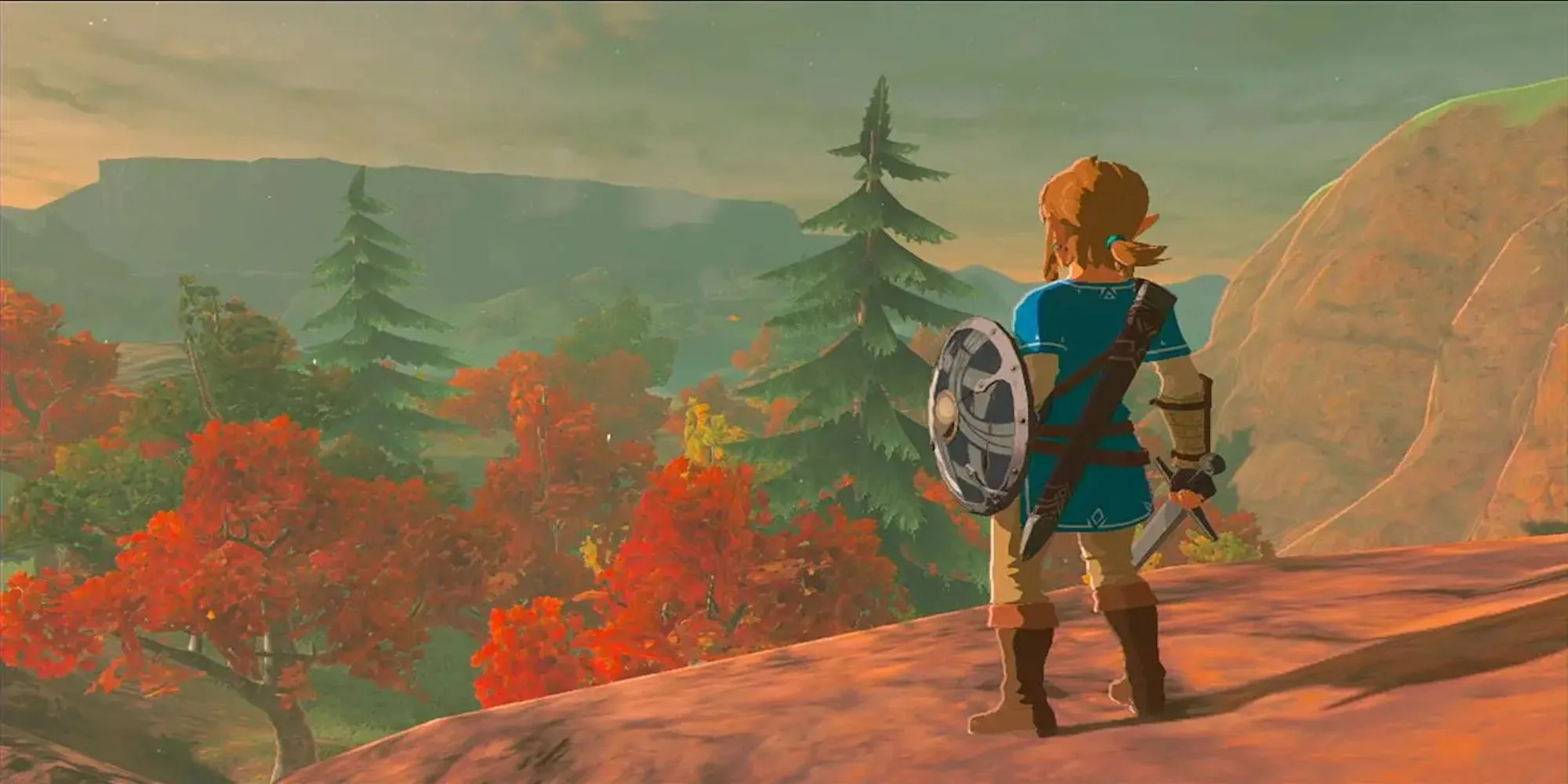 Link nhìn ra vùng đất Hyrule rộng lớn trong Breath of the Wild, một thế giới mở với cốt truyện được hé lộ qua ký ức.