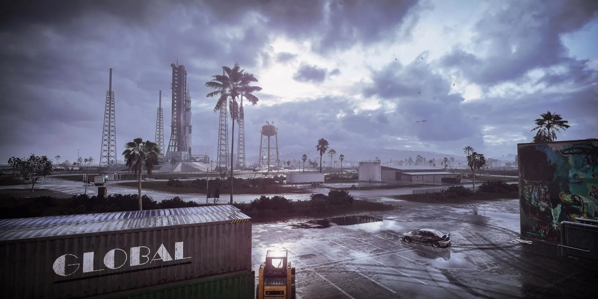 Một chiếc xe đua thể thao màu vàng đang drift trên đường phố Palm City vào ban đêm trong Need for Speed Heat