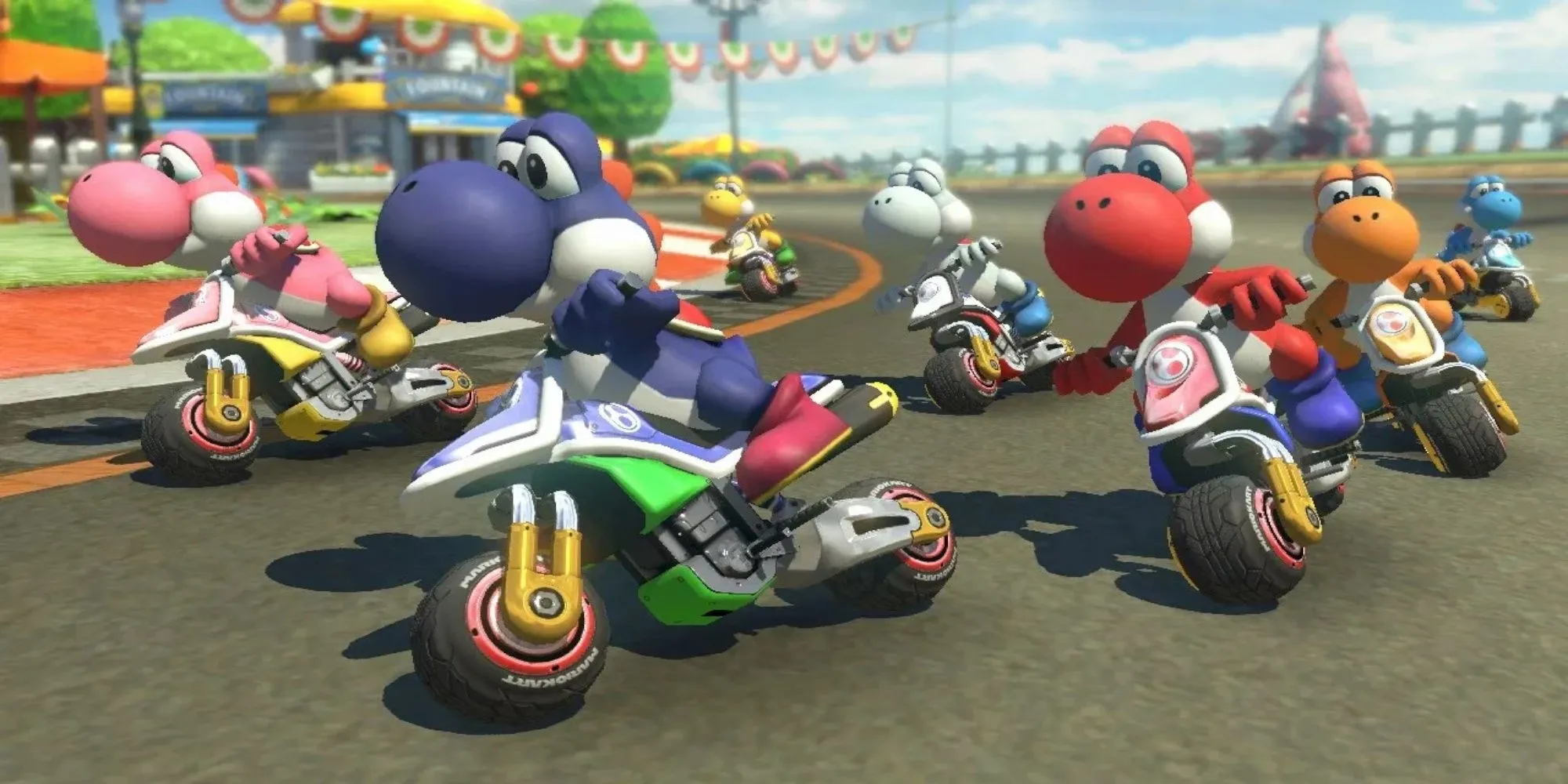 Nhân vật Mario đang drift điệu nghệ trong game Mario Kart 8 trên một đường đua rực rỡ sắc màu