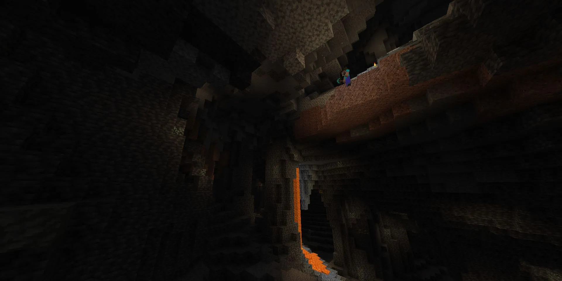 Nhân vật Steve cheo leo trên mép vực nhìn xuống hang động khổng lồ bên dưới trong Minecraft