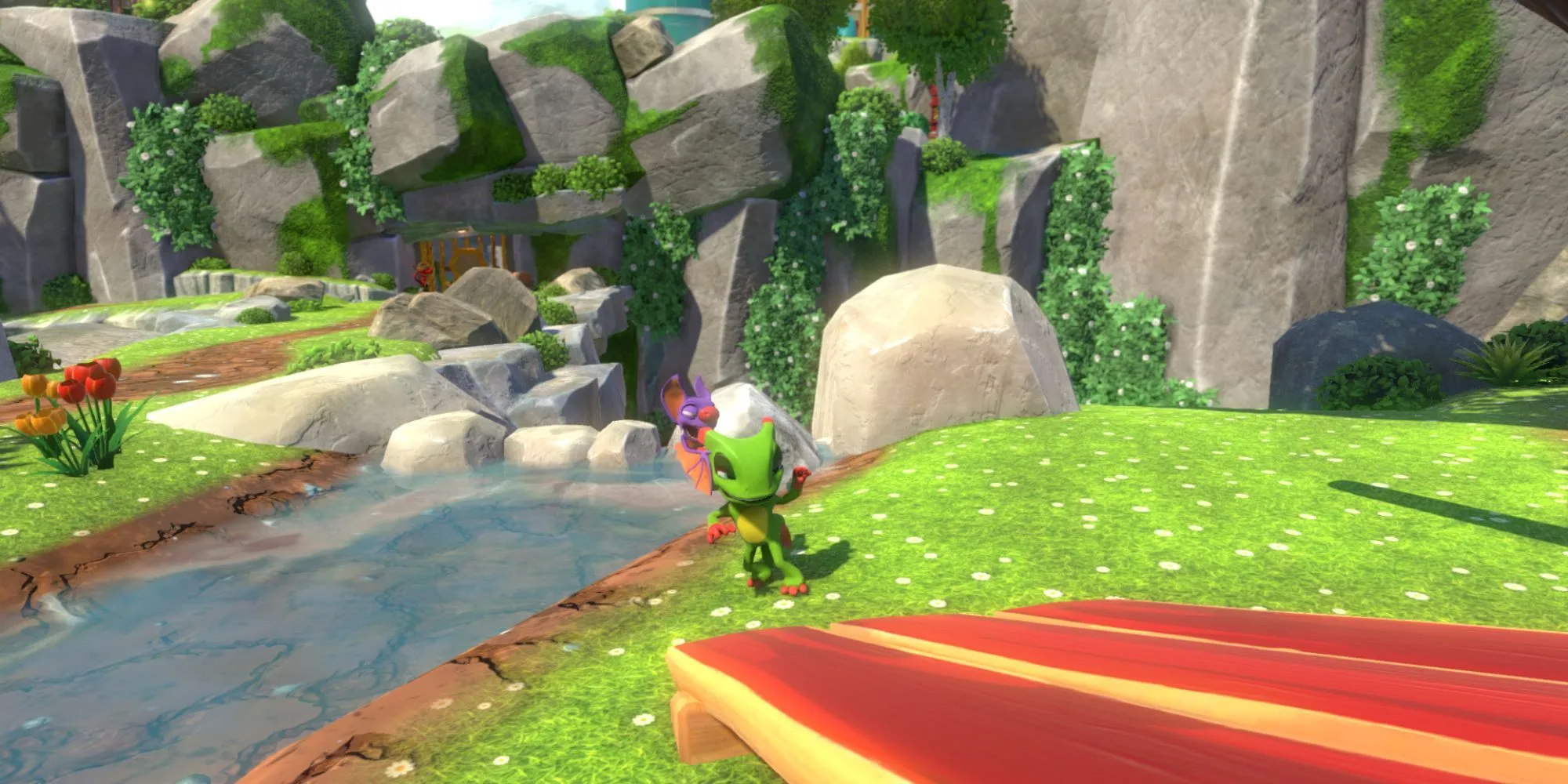 Yooka và Laylee đứng cạnh một dòng sông trong thế giới game đầy màu sắc của Yooka-Laylee