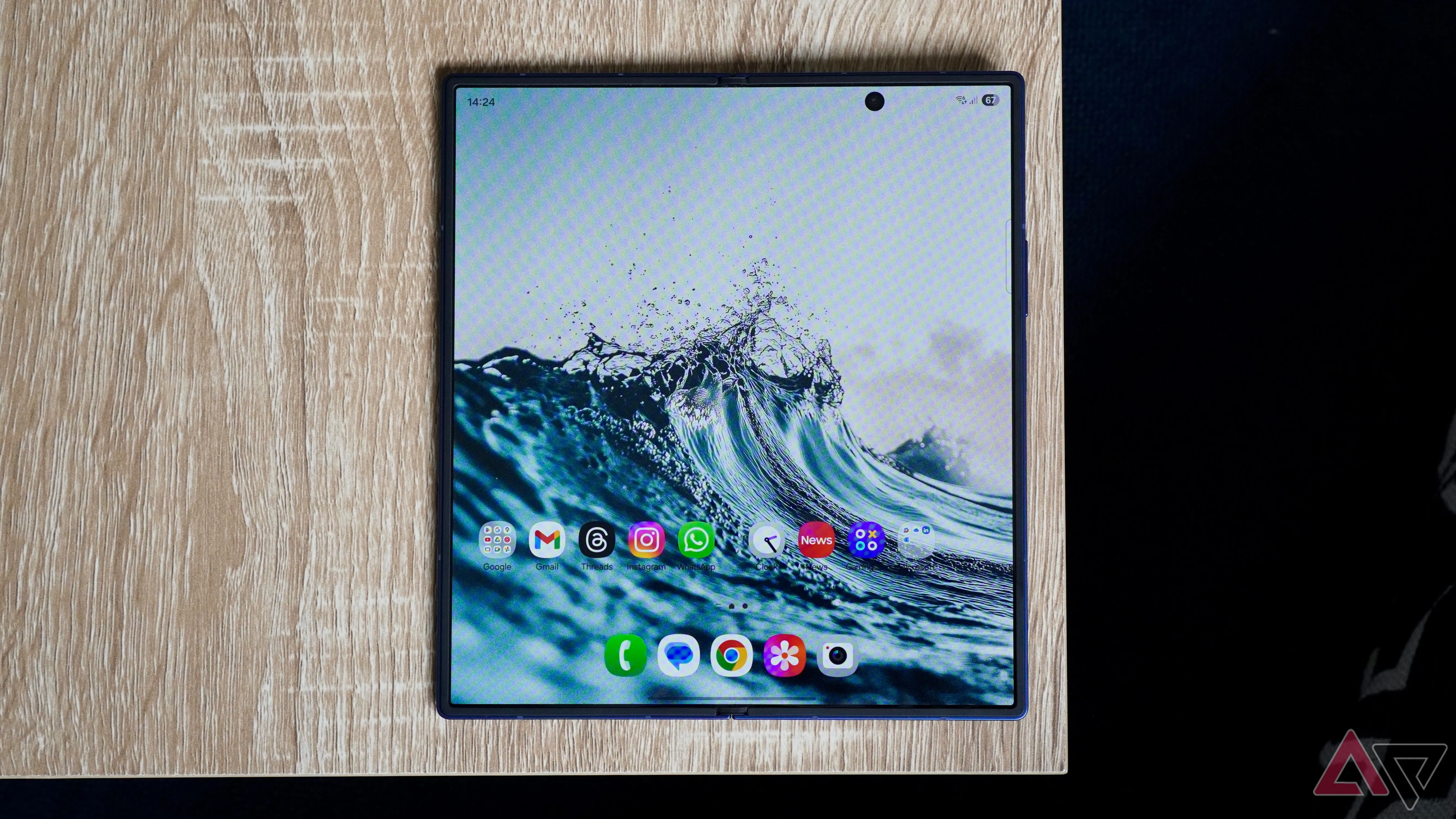 The Galaxy Z Fold 7 opened on a brown wooden table